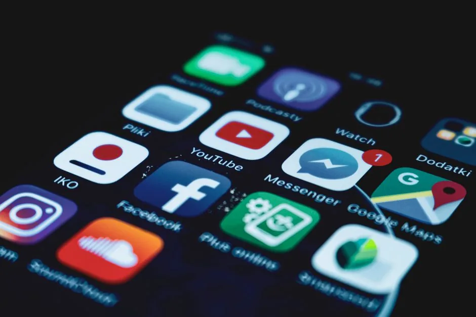 Detailed close-up view of a smartphone screen displaying various popular social media app icons.