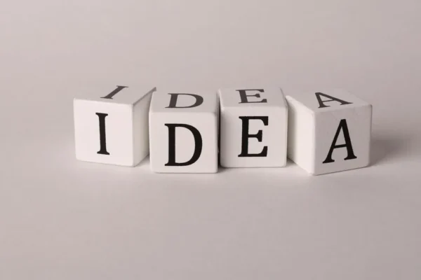 White blocks with letters spelling 'IDEA' representing creativity and innovation.