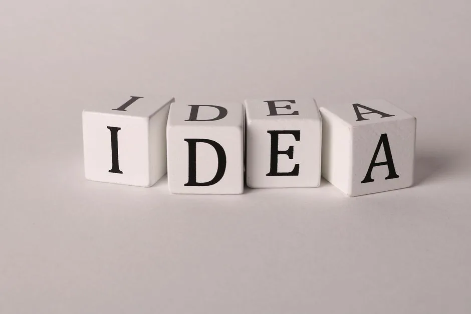 White blocks with letters spelling 'IDEA' representing creativity and innovation.