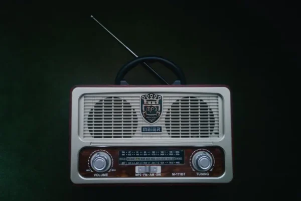 Classic retro radio with vintage design, featuring an antenna for FM, AM, and SW bands.