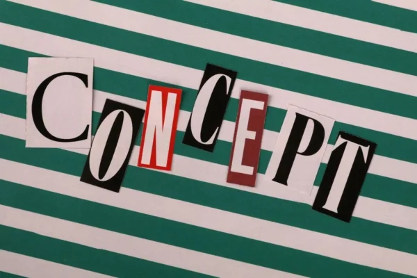 Vintage cut-out letters spelling 'CONCEPT' on a striped background.